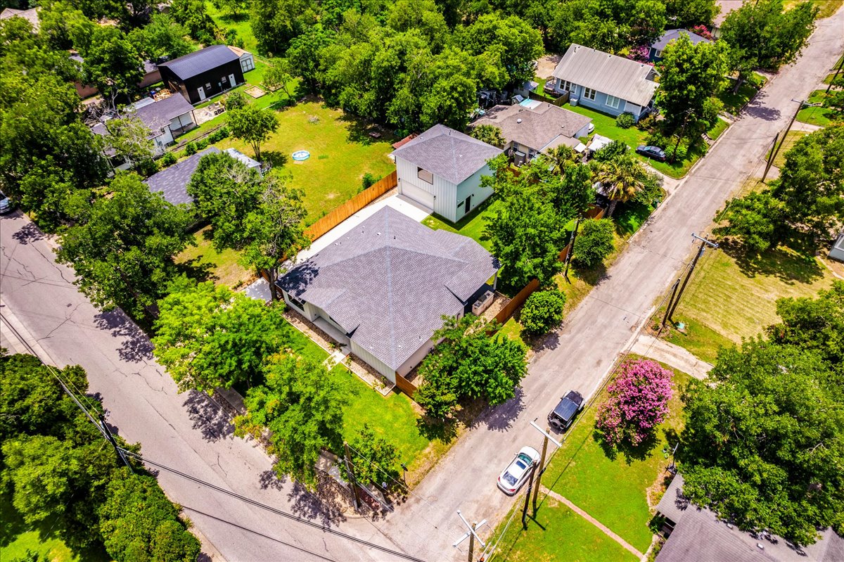 1215 Howard Street Taylor, TX 76574 - Photo 34 of 37 an aerial view of a house with a yard and garden