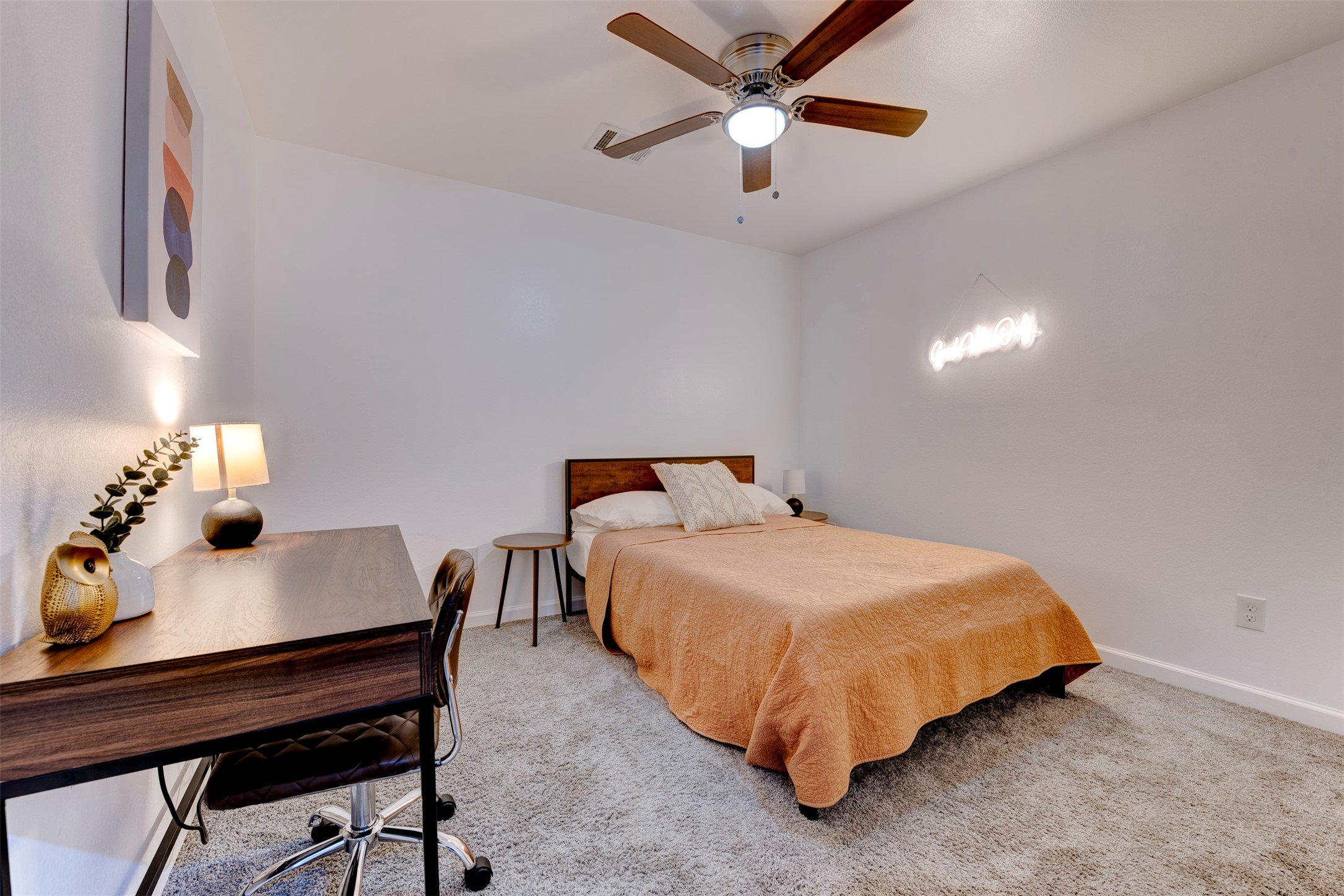 2631 Stevens Street Houston, TX 77026 - Photo 14 of 25 A third secondary bedroom offers enough space for a desk or reading nook. Complete with a ceiling fan and light kit, it’s a comfortable and flexible space.
