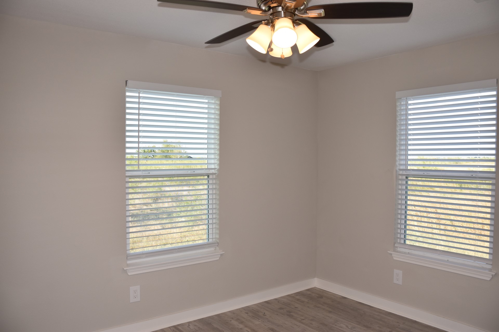 3751 County Road 463 Elgin, TX 78621 - Photo 23 of 27 an empty room with a window and a chandelier fan