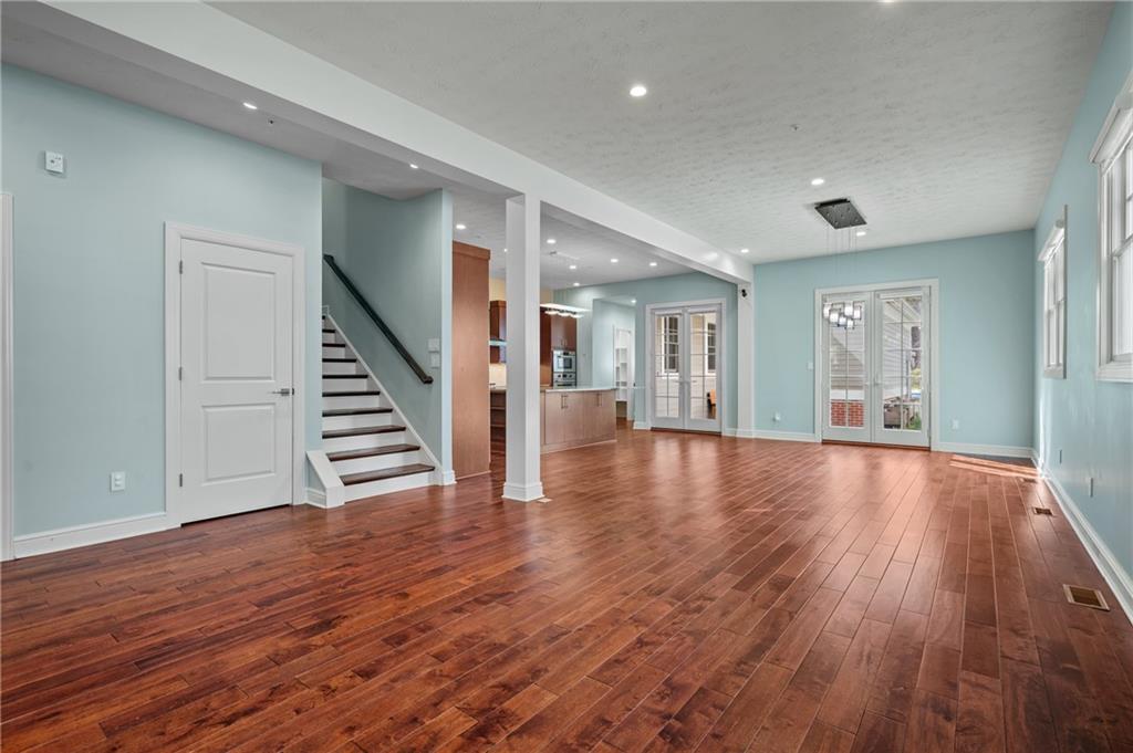 1759 Parkview Boulevard Pittsburgh, PA 15217 - Photo 5 of 45 a view of an empty room with wooden floor and stairs