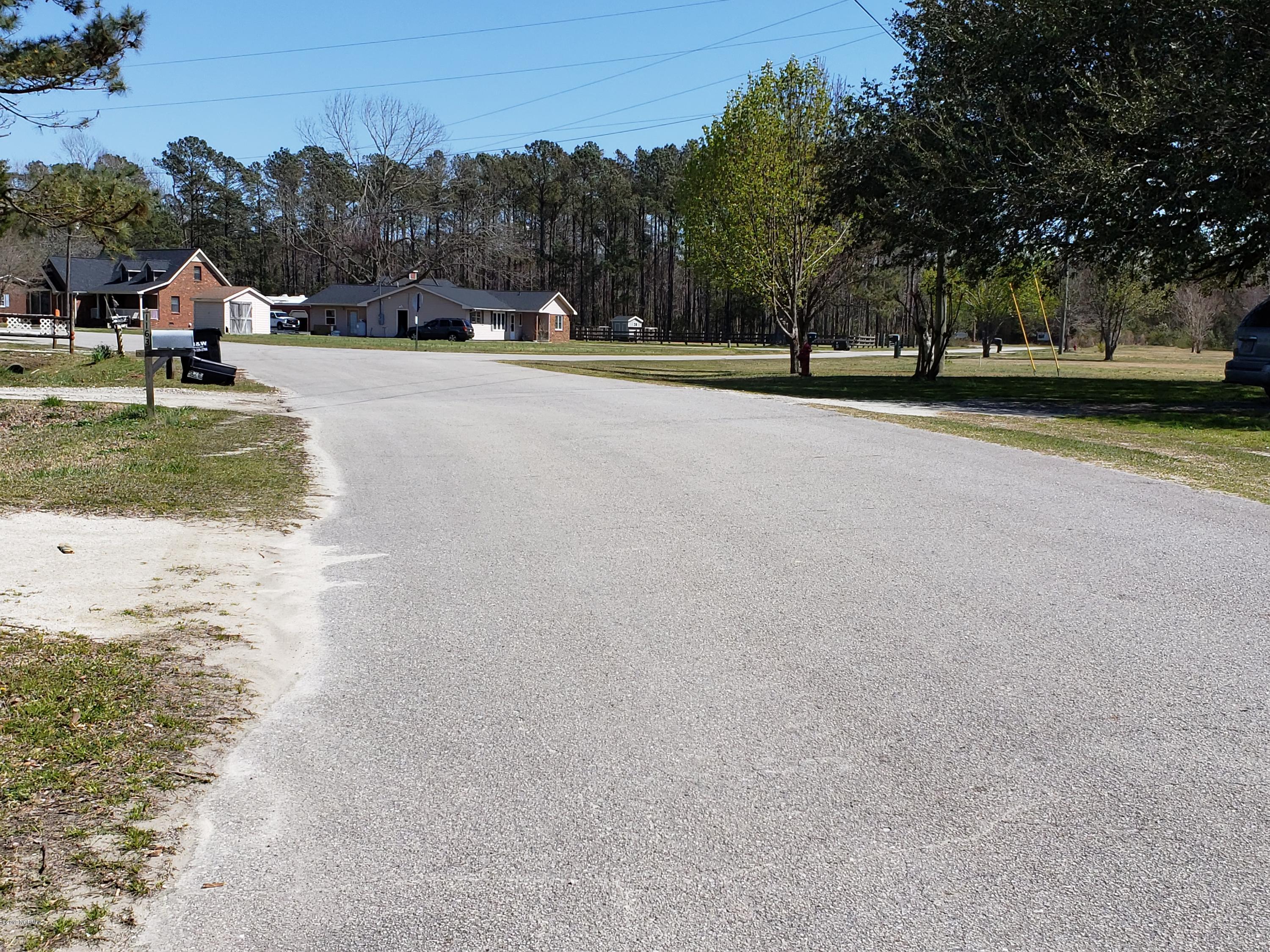 1157 South Parker Road Holly Ridge, NC 28445 - Photo 1 of 57 Roadway into the neighborhood.