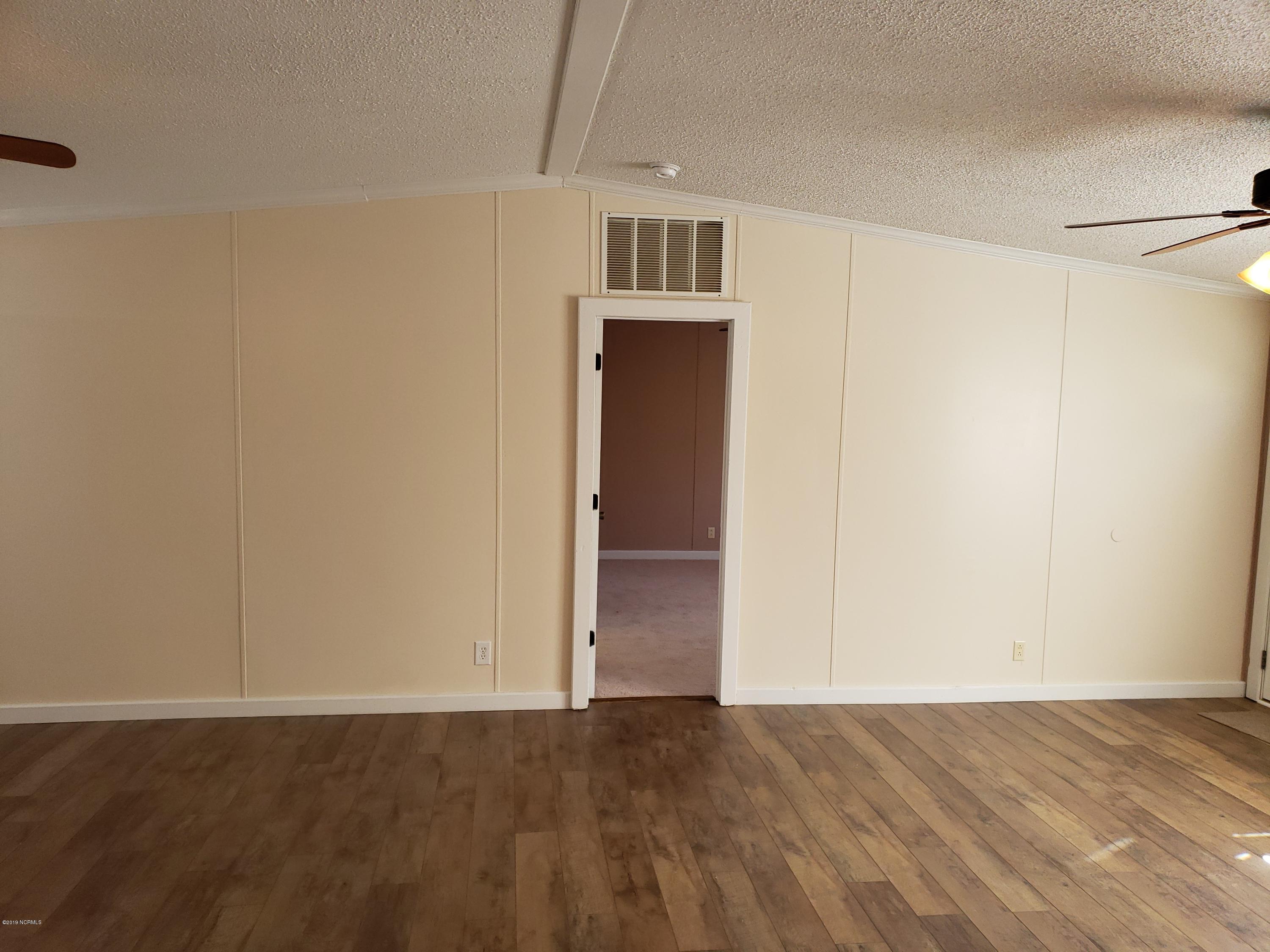 1157 South Parker Road Holly Ridge, NC 28445 - Photo 26 of 57 Master Bedroom Entry from Living Room.
