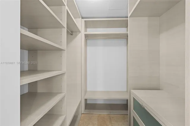 a view of an empty walk in closet