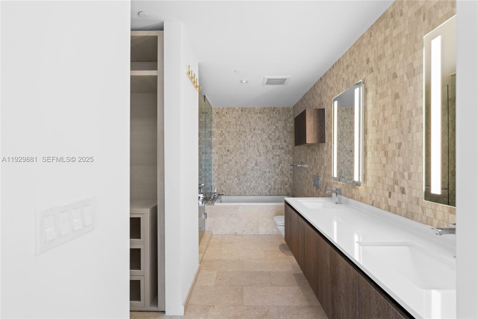 88 Southwest 7th Street, Unit 3608 Miami, FL 33130 - Photo 12 of 36 a bathroom with a bathtub and a sink