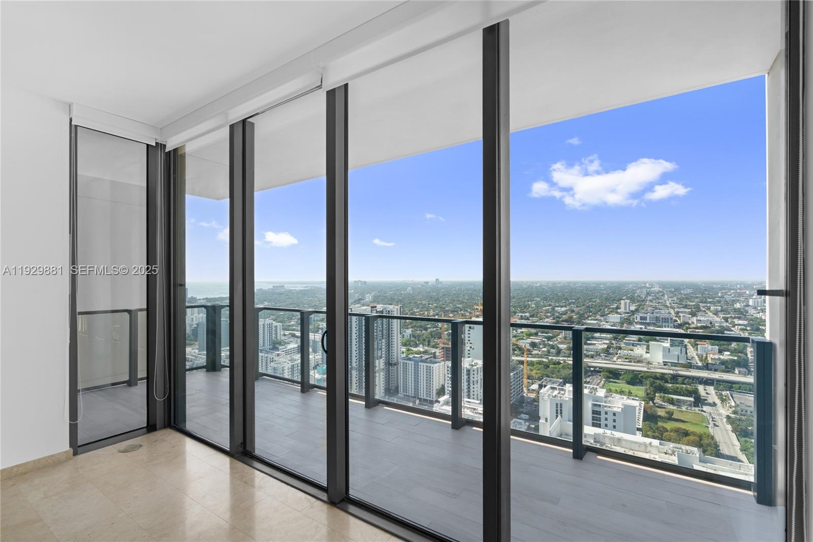 88 Southwest 7th Street, Unit 3608 Miami, FL 33130 - Photo 15 of 36 a view of a floor to ceiling window and an outdoor view