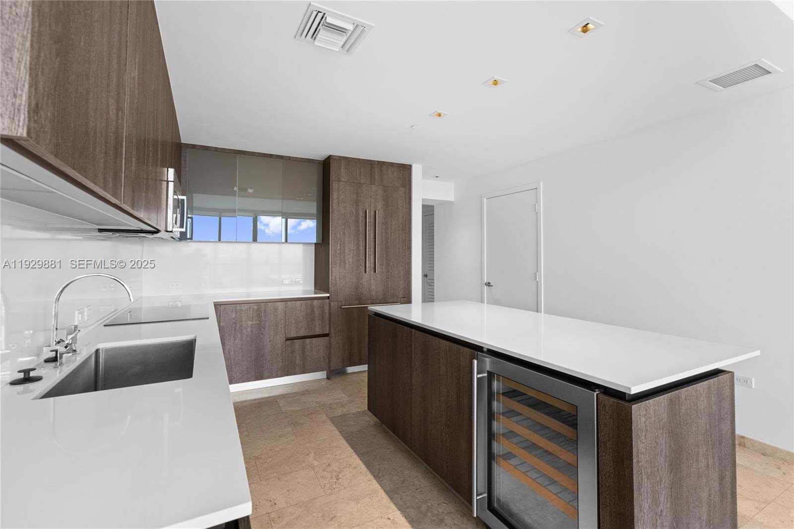 88 Southwest 7th Street, Unit 3608 Miami, FL 33130 - Photo 31 of 36 a kitchen with white cabinets a sink and dishwasher