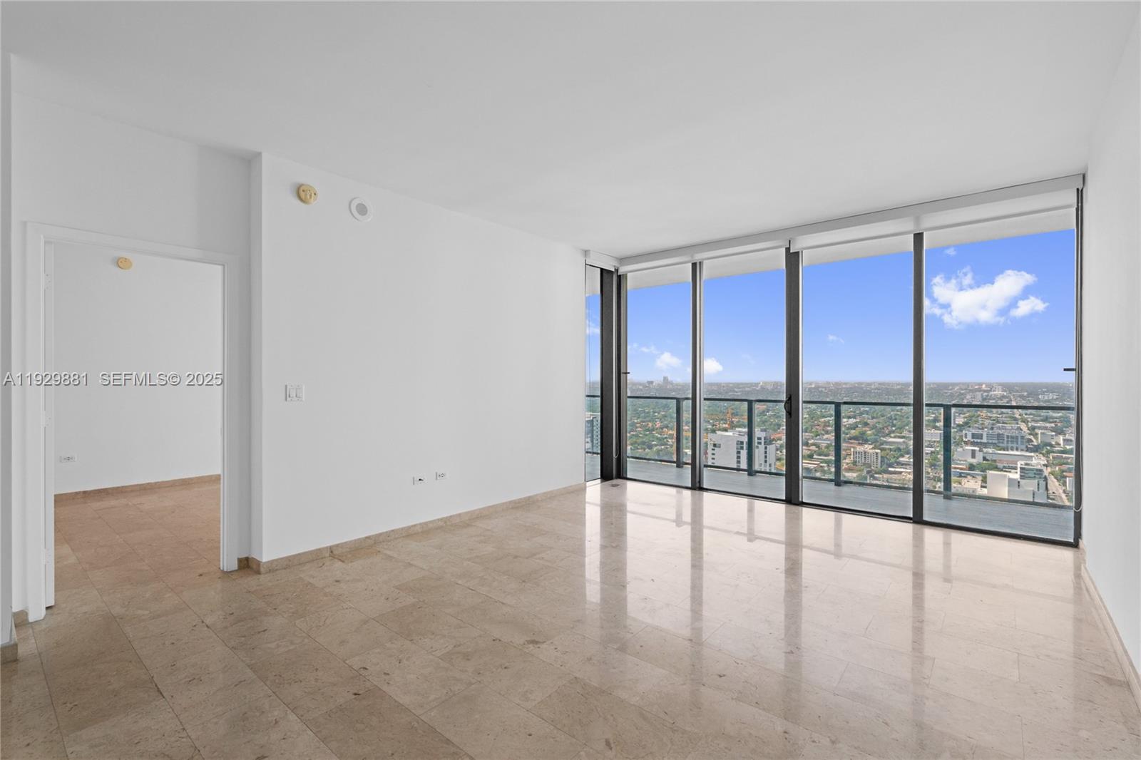 88 Southwest 7th Street, Unit 3608 Miami, FL 33130 - Photo 32 of 36 wooden floor in an empty room with a window