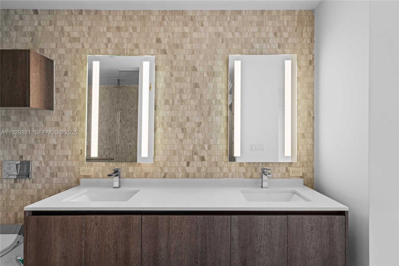 88 Southwest 7th Street, Unit 3608 Miami, FL 33130 - Photo 9 of 36 a bathroom with a sink and a mirror