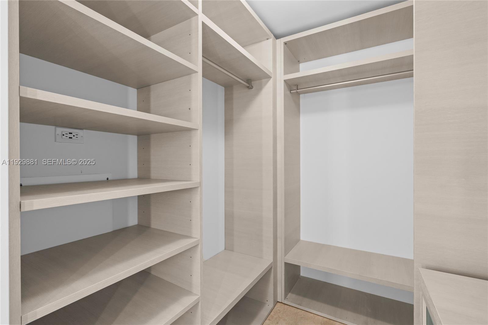 88 Southwest 7th Street, Unit 3608 Miami, FL 33130 - Photo 10 of 36 a view of walk in closet with empty racks