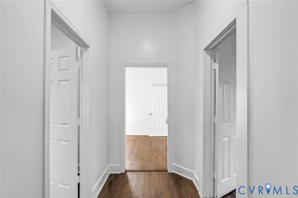 a view of an entryway with wooden floor