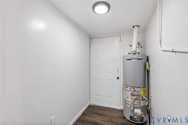 a view of walk in closet with wooden floor