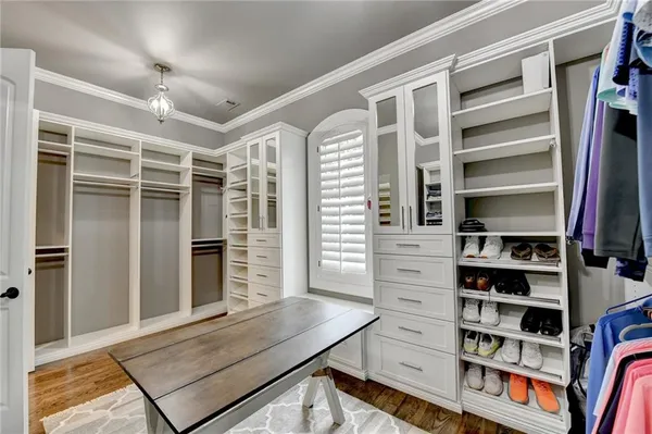 a view of a house with swimming pool and sitting area
