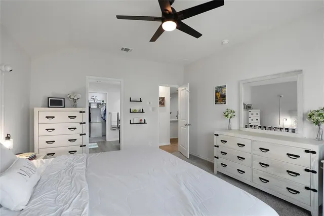 a bedroom with furniture and a bathroom