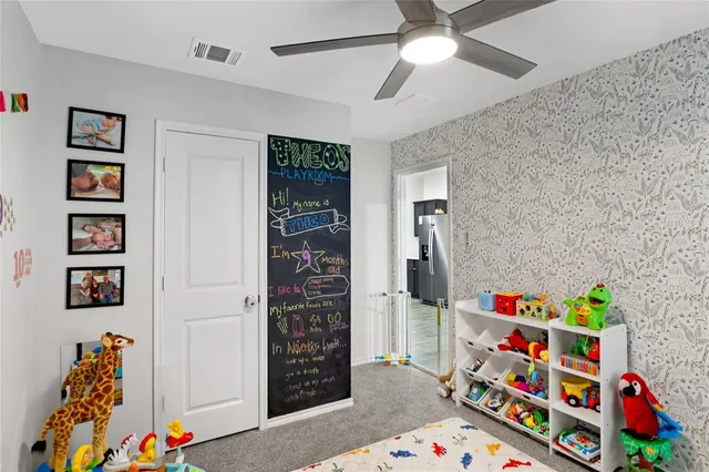 a room with toys and book shelf