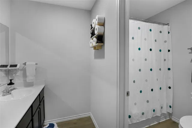 a bathroom with a sink and mirror