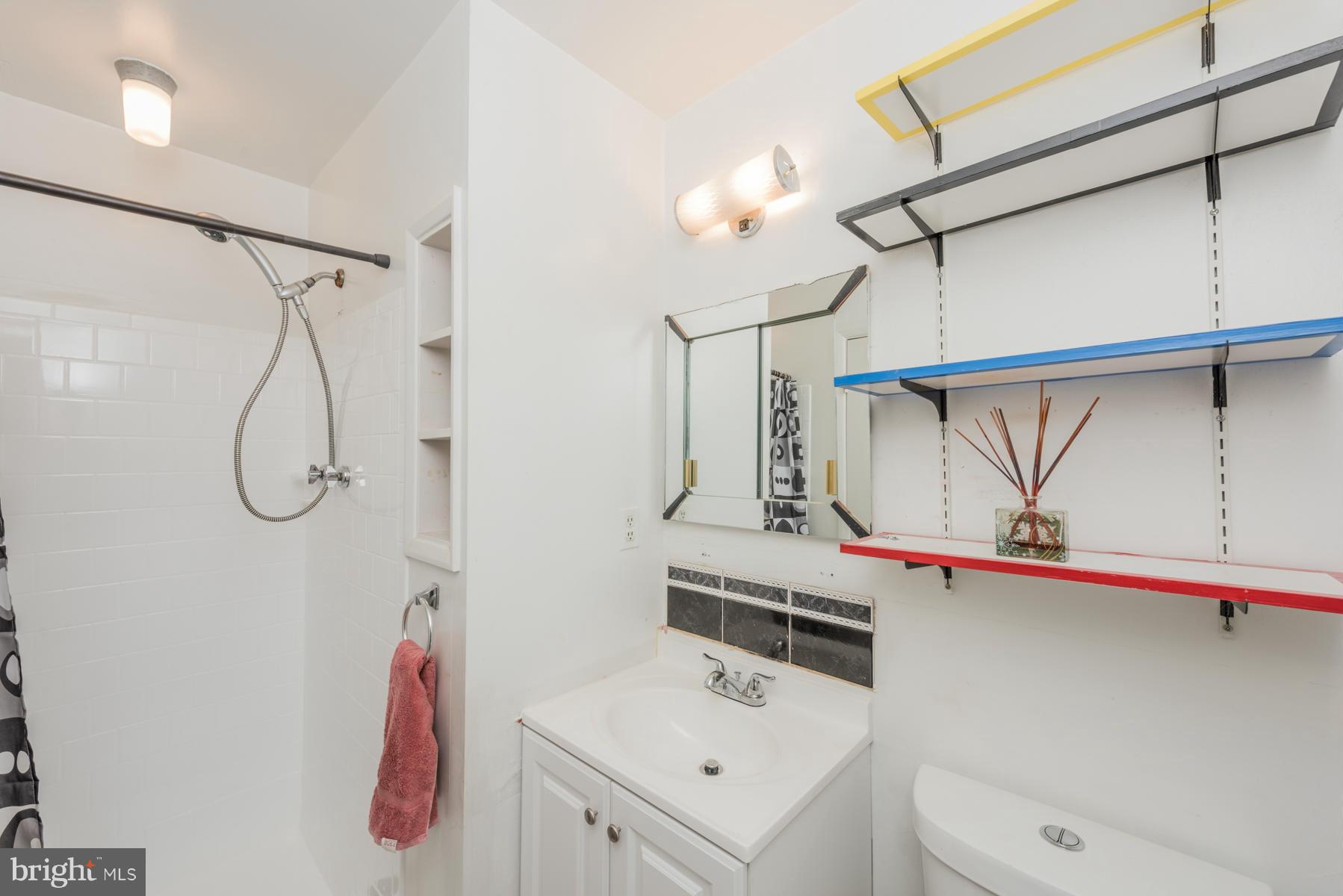 3319 Lauri Road Baltimore, MD 21244 - Photo 14 of 28 a bathroom with a sink a toilet and shower