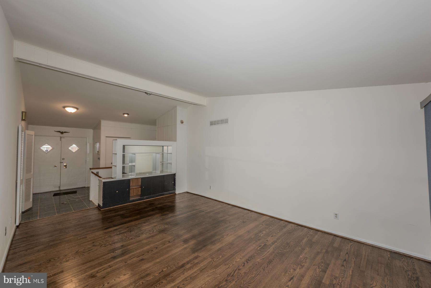 3319 Lauri Road Baltimore, MD 21244 - Photo 3 of 28 a view of a kitchen with wooden floor and windows
