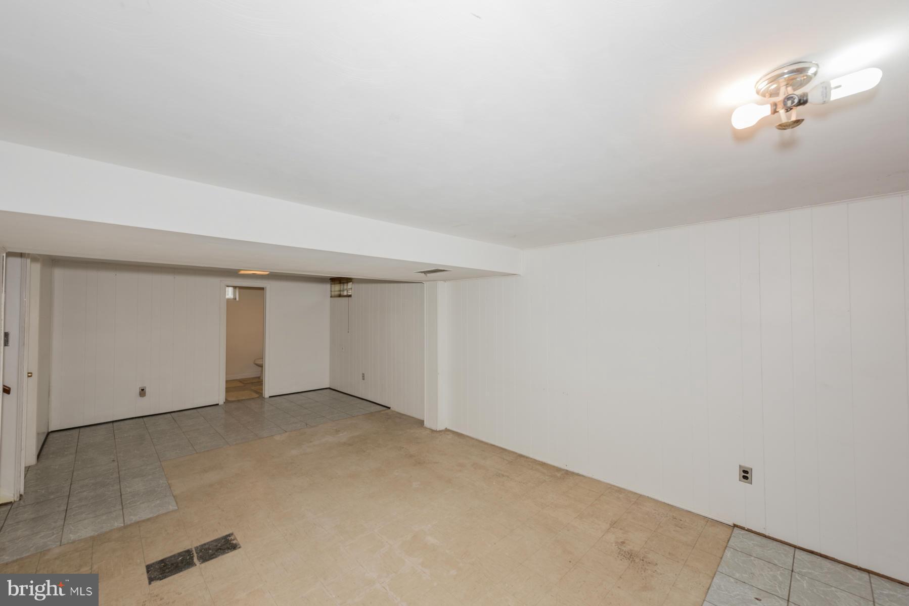 3319 Lauri Road Baltimore, MD 21244 - Photo 21 of 28 an empty room with a chandelier fan