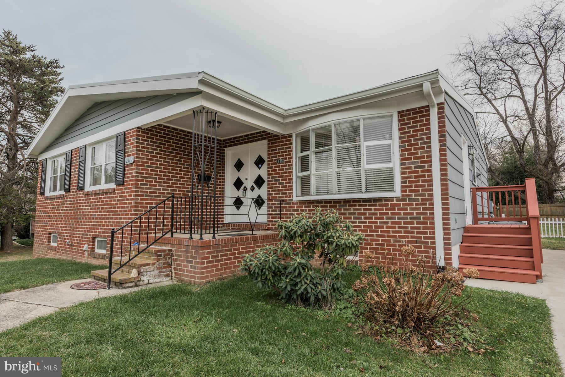 3319 Lauri Road Baltimore, MD 21244 - Photo 25 of 28 a front view of a house with a garden