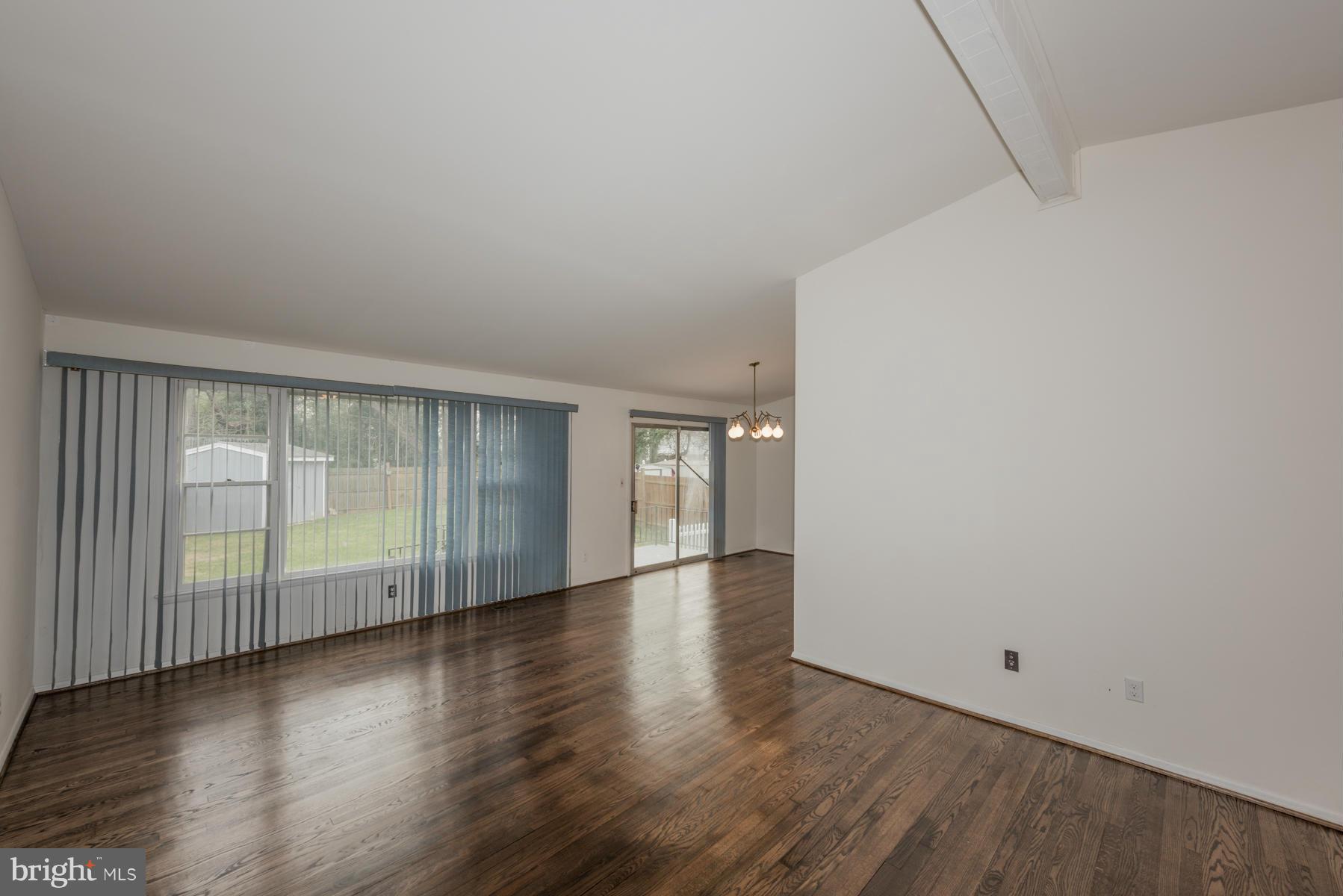 3319 Lauri Road Baltimore, MD 21244 - Photo 4 of 28 an empty room with wooden floor and windows