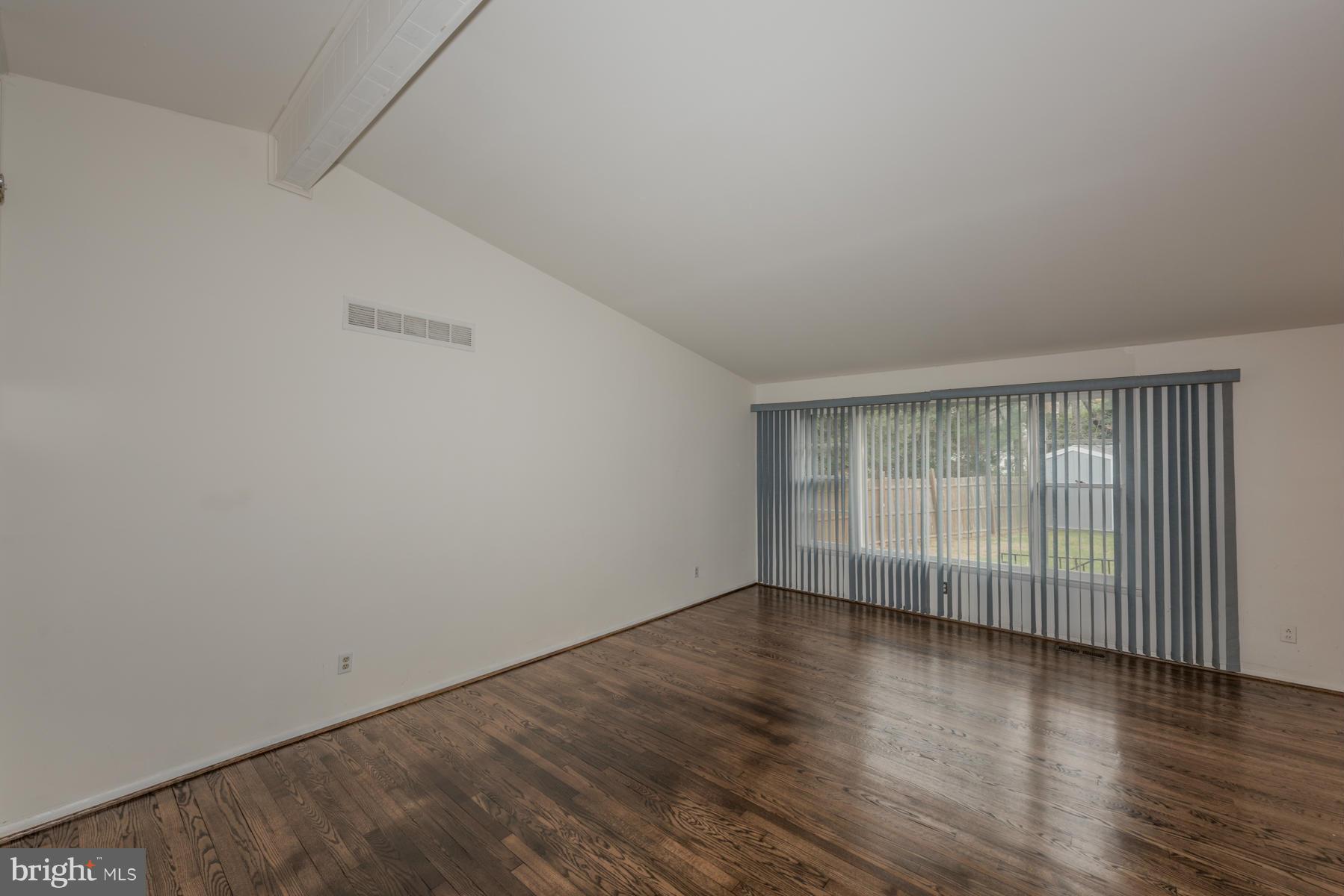 3319 Lauri Road Baltimore, MD 21244 - Photo 5 of 28 wooden floor in an empty room with a window