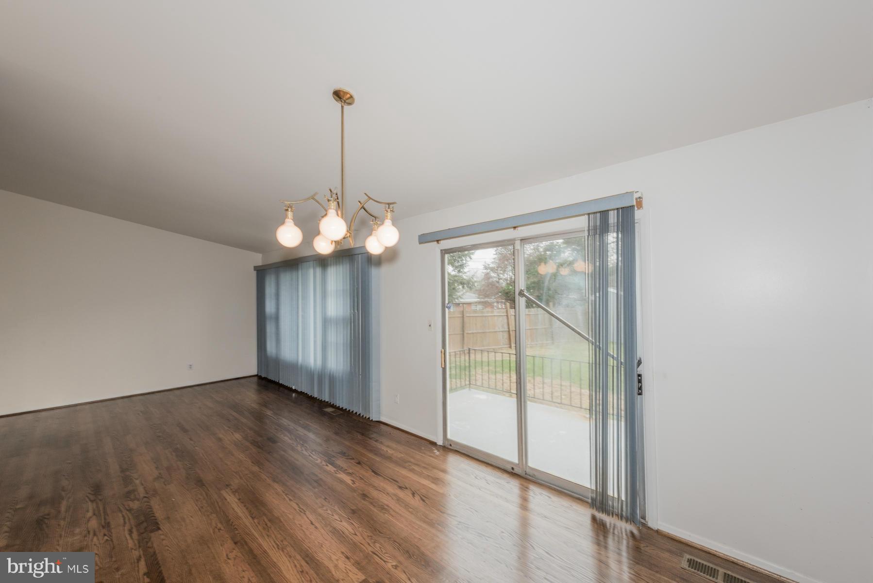 3319 Lauri Road Baltimore, MD 21244 - Photo 6 of 28 a view of a room with wooden floor fan and windows