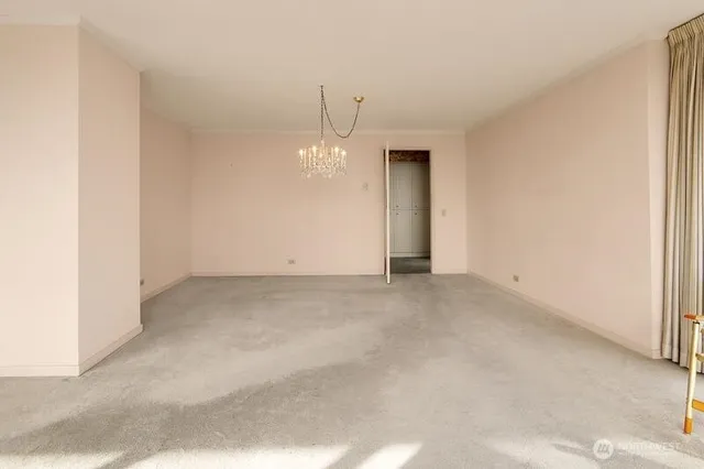 a view of a dining room with furniture and a potted plant