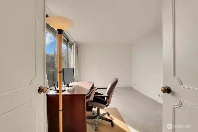 a bathroom with a toilet and shower curtain
