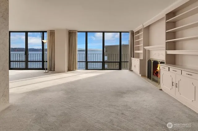 a view of a bedroom with furniture and windows