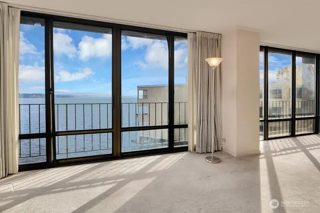 a view of a large window with backyard floor