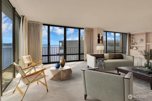 a living room with furniture and a large window