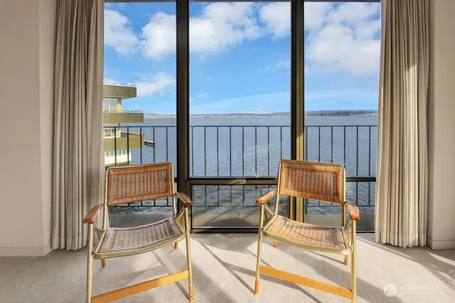 a view of a balcony with furniture