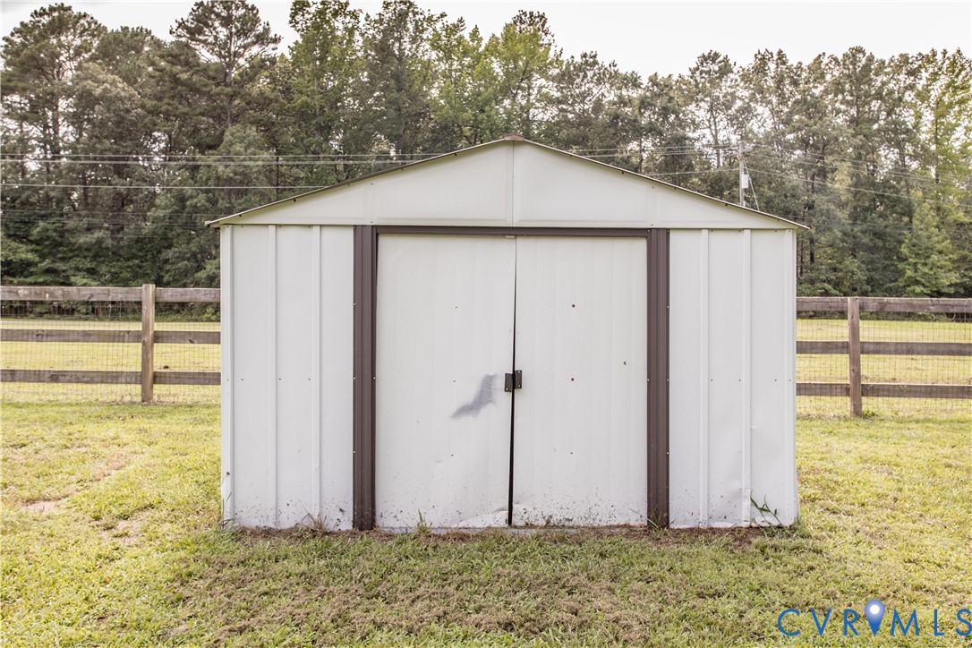 20411 Horseshoe Road Carson, VA 23830 - Photo 12 of 35 Metal storage shed with a peaked roof, double door
