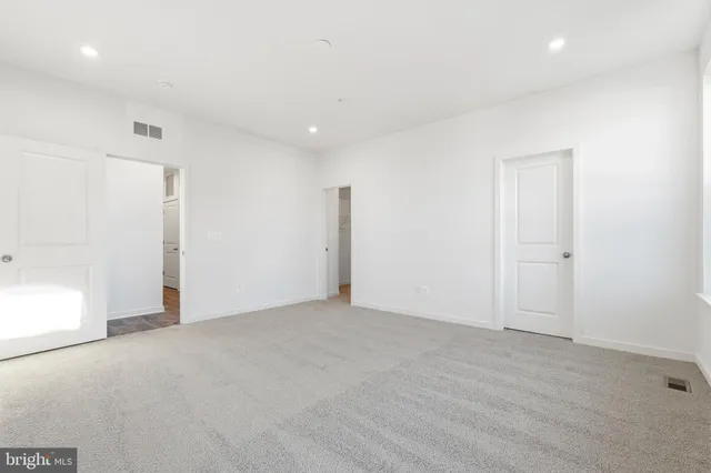 a bathroom with a double vanity sink mirror and