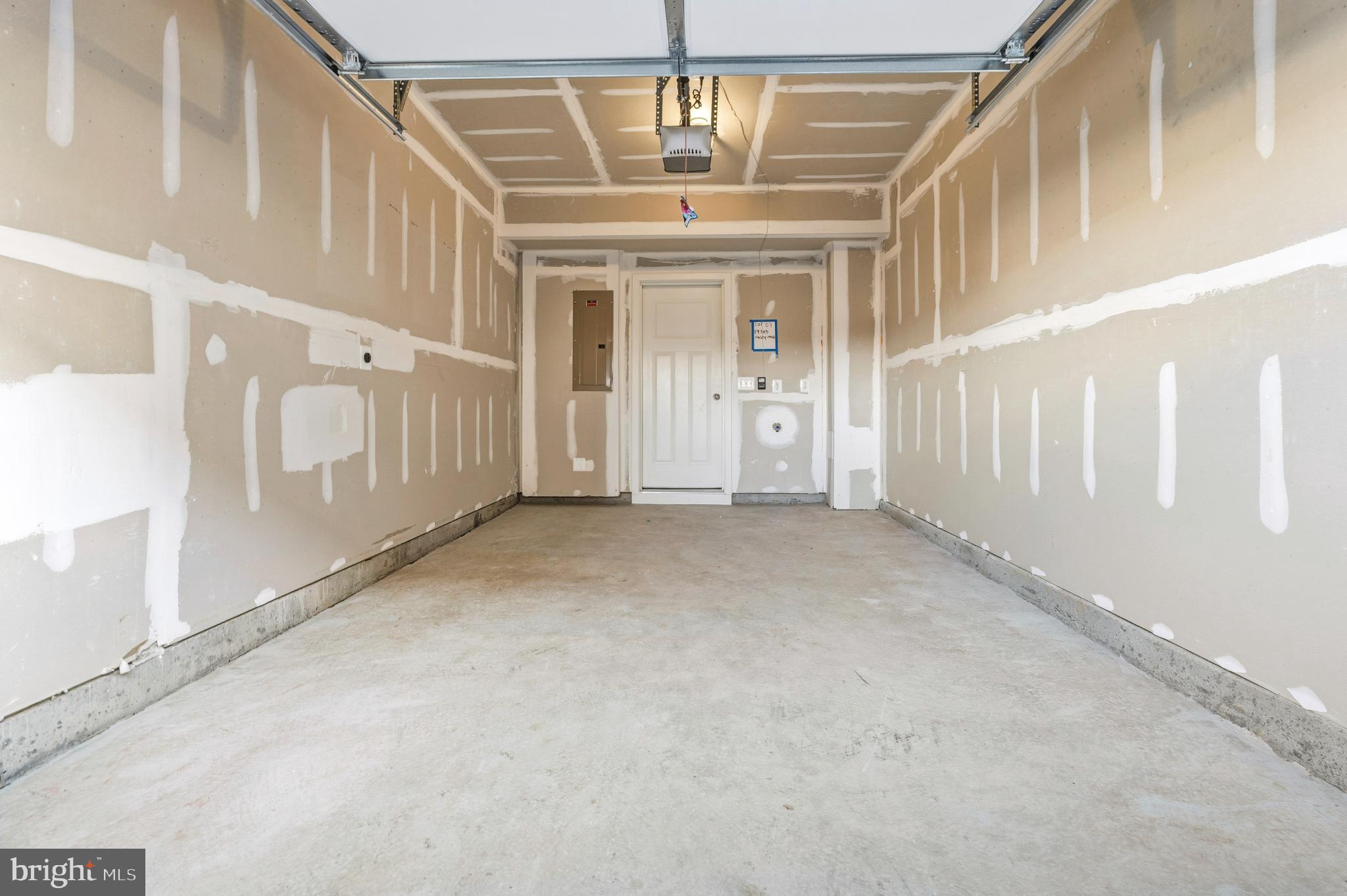 19705 Misty Moss Square Ashburn, VA 20147 - Photo 23 of 25 Spacious garage ready for your vision.