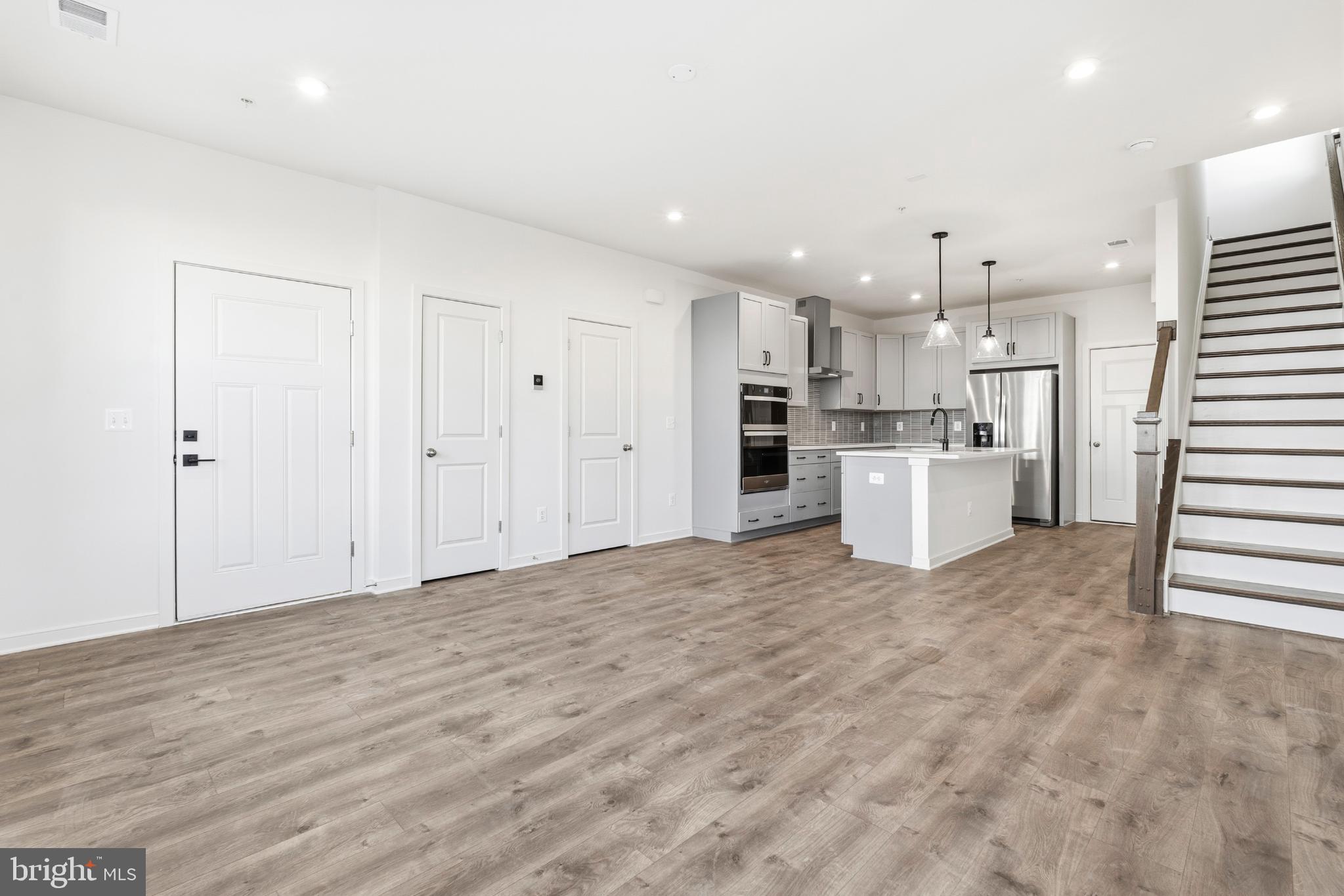 19705 Misty Moss Square Ashburn, VA 20147 - Photo 4 of 25 Spacious modern living area with sleek design.