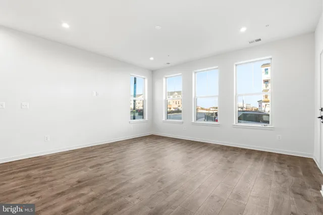 a bathroom with a sink mirror and toilet