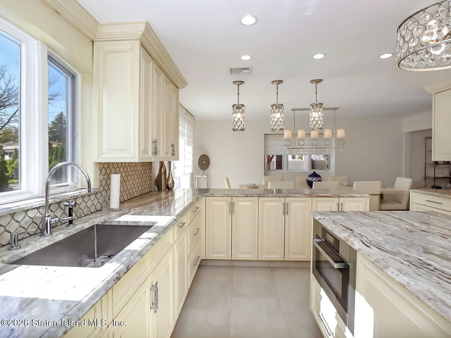 160 Wolverine Street Staten Island, NY 10306 - Photo 13 of 51 a large kitchen with a sink and cabinets