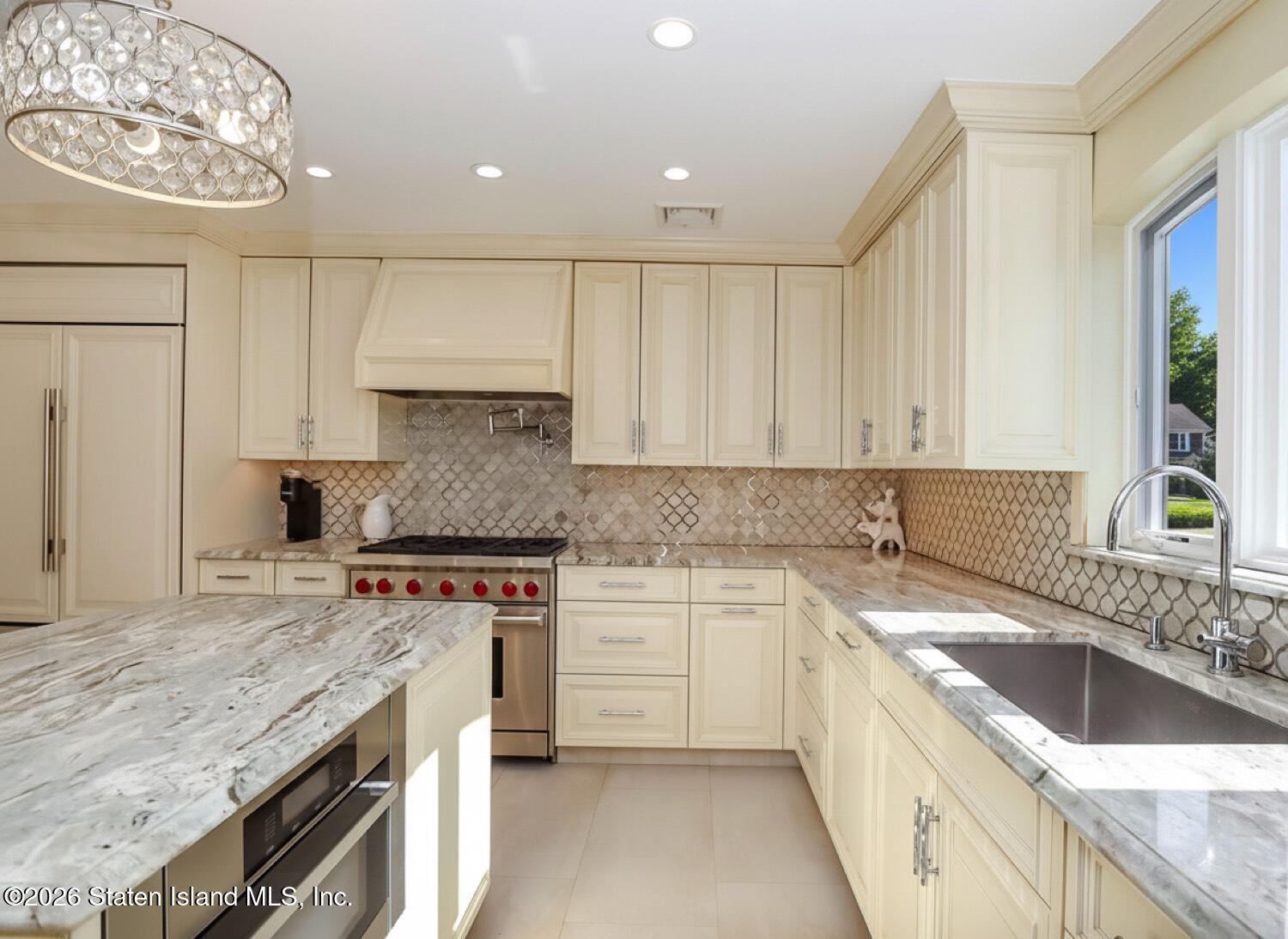 160 Wolverine Street Staten Island, NY 10306 - Photo 16 of 51 a kitchen with a sink stove top oven and cabinets