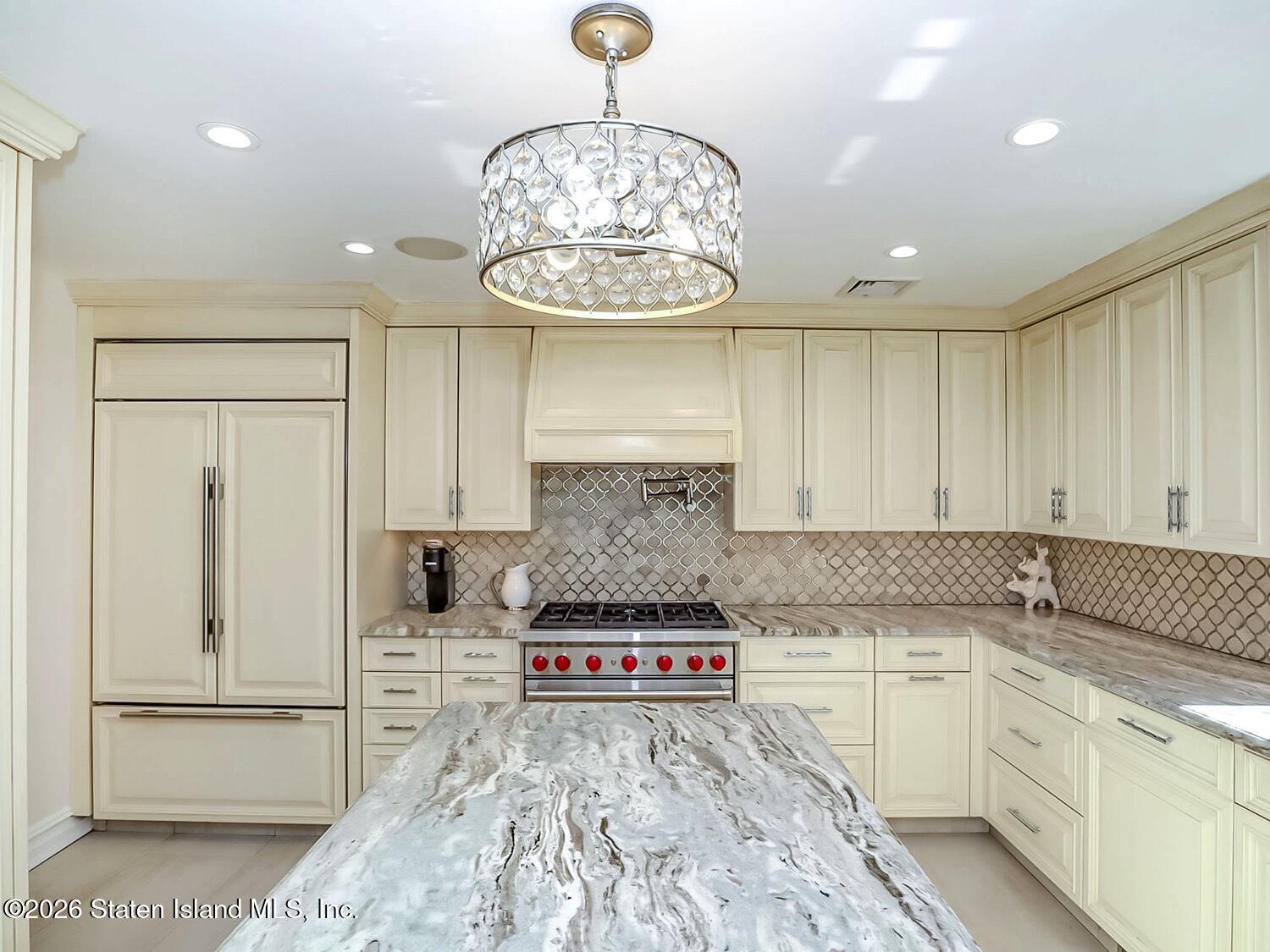 160 Wolverine Street Staten Island, NY 10306 - Photo 17 of 51 a kitchen with stainless steel appliances granite countertop a stove and cabinets