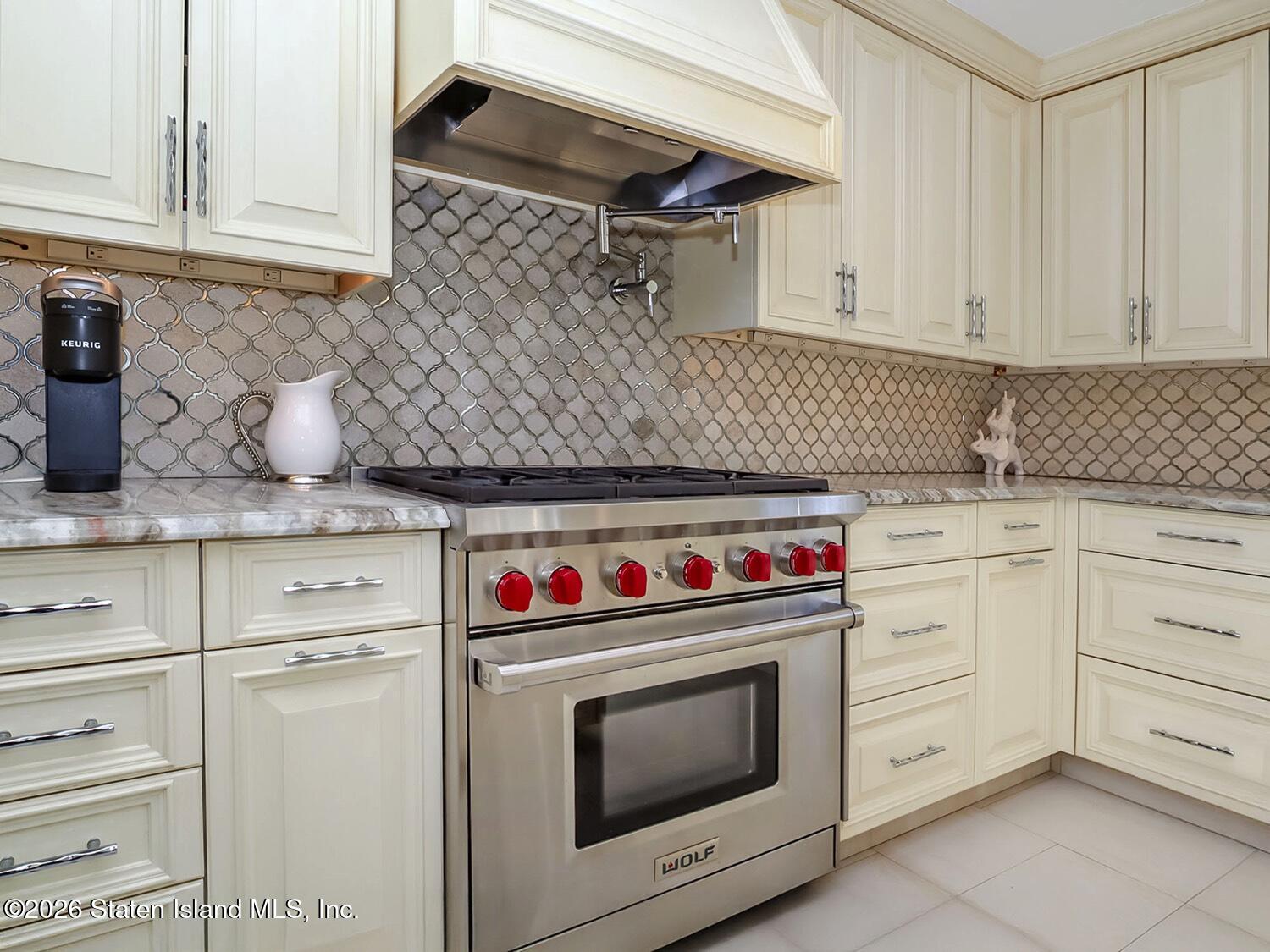 160 Wolverine Street Staten Island, NY 10306 - Photo 18 of 51 a kitchen with granite countertop white cabinets and white appliances