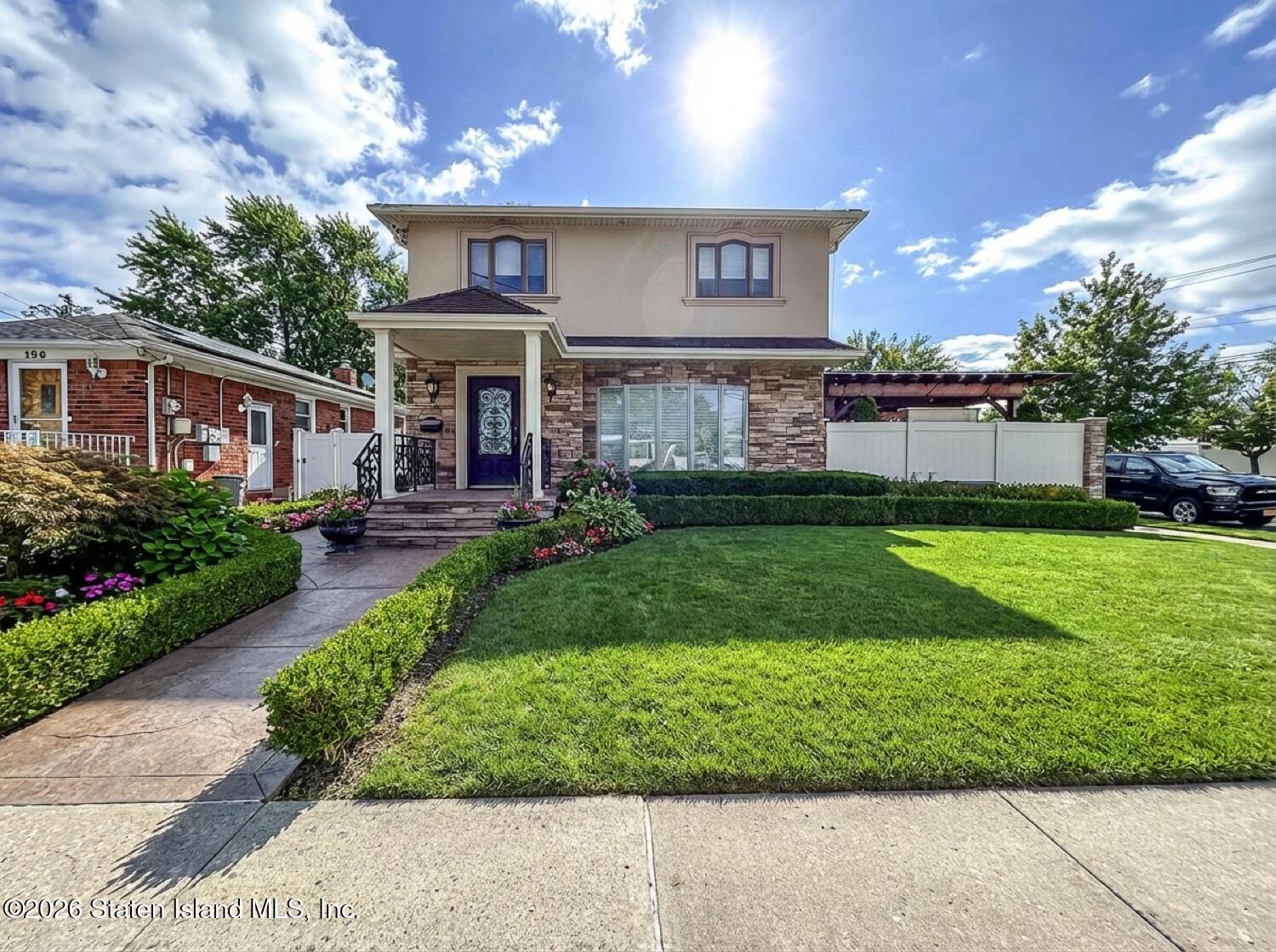 160 Wolverine Street Staten Island, NY 10306 - Photo 2 of 51 a front view of a house with a yard