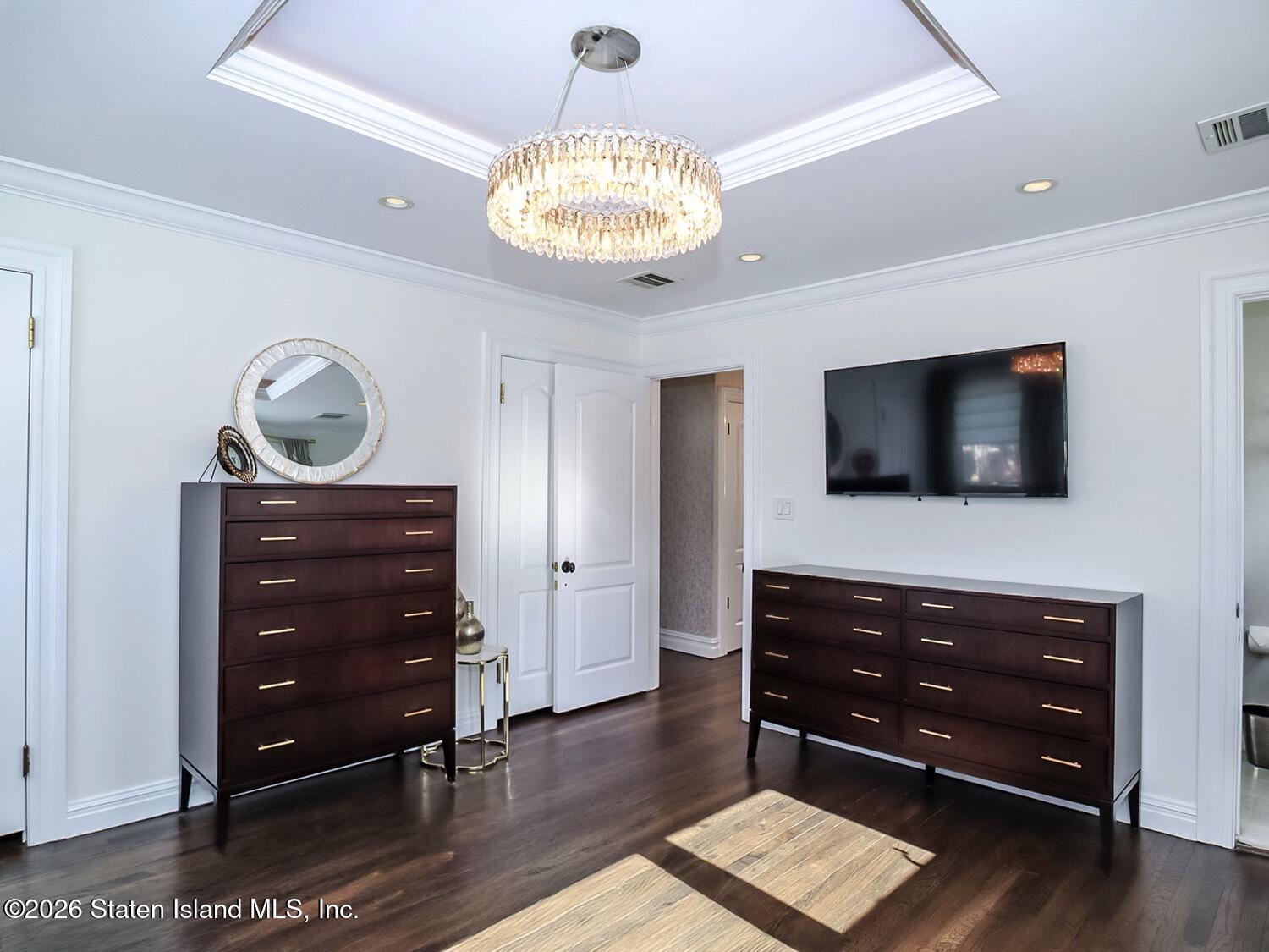 160 Wolverine Street Staten Island, NY 10306 - Photo 23 of 51 a living room with a dresser and a flat screen tv