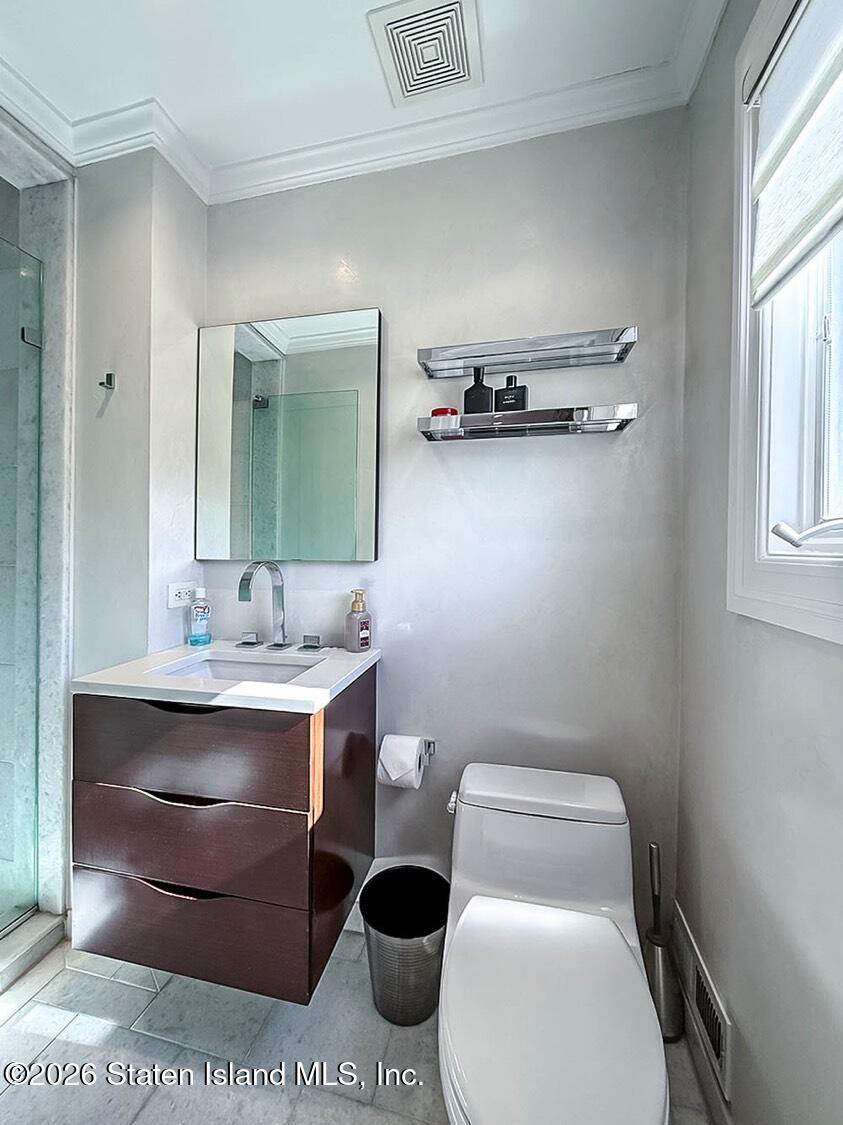 160 Wolverine Street Staten Island, NY 10306 - Photo 25 of 51 a bathroom with a toilet and a sink