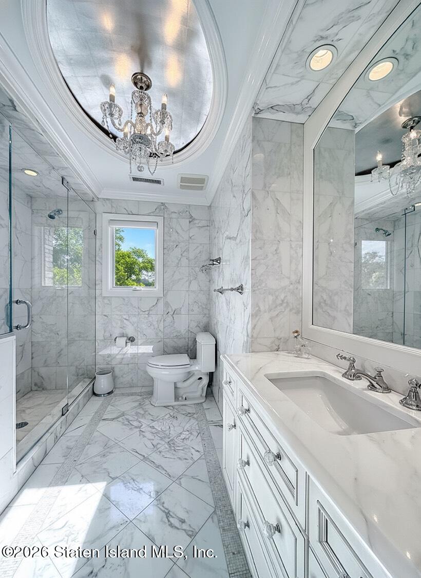 160 Wolverine Street Staten Island, NY 10306 - Photo 28 of 51 a spacious bathroom with a granite countertop sink a toilet a mirror and shower