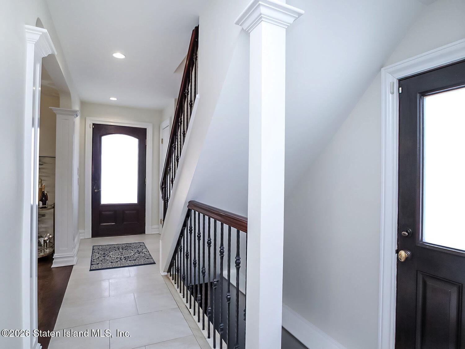 160 Wolverine Street Staten Island, NY 10306 - Photo 33 of 51 a view of a hallway with wooden floor and staircase