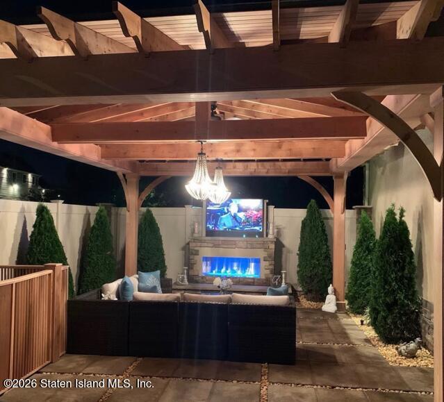 160 Wolverine Street Staten Island, NY 10306 - Photo 42 of 51 a view of a patio with table and chairs potted plants
