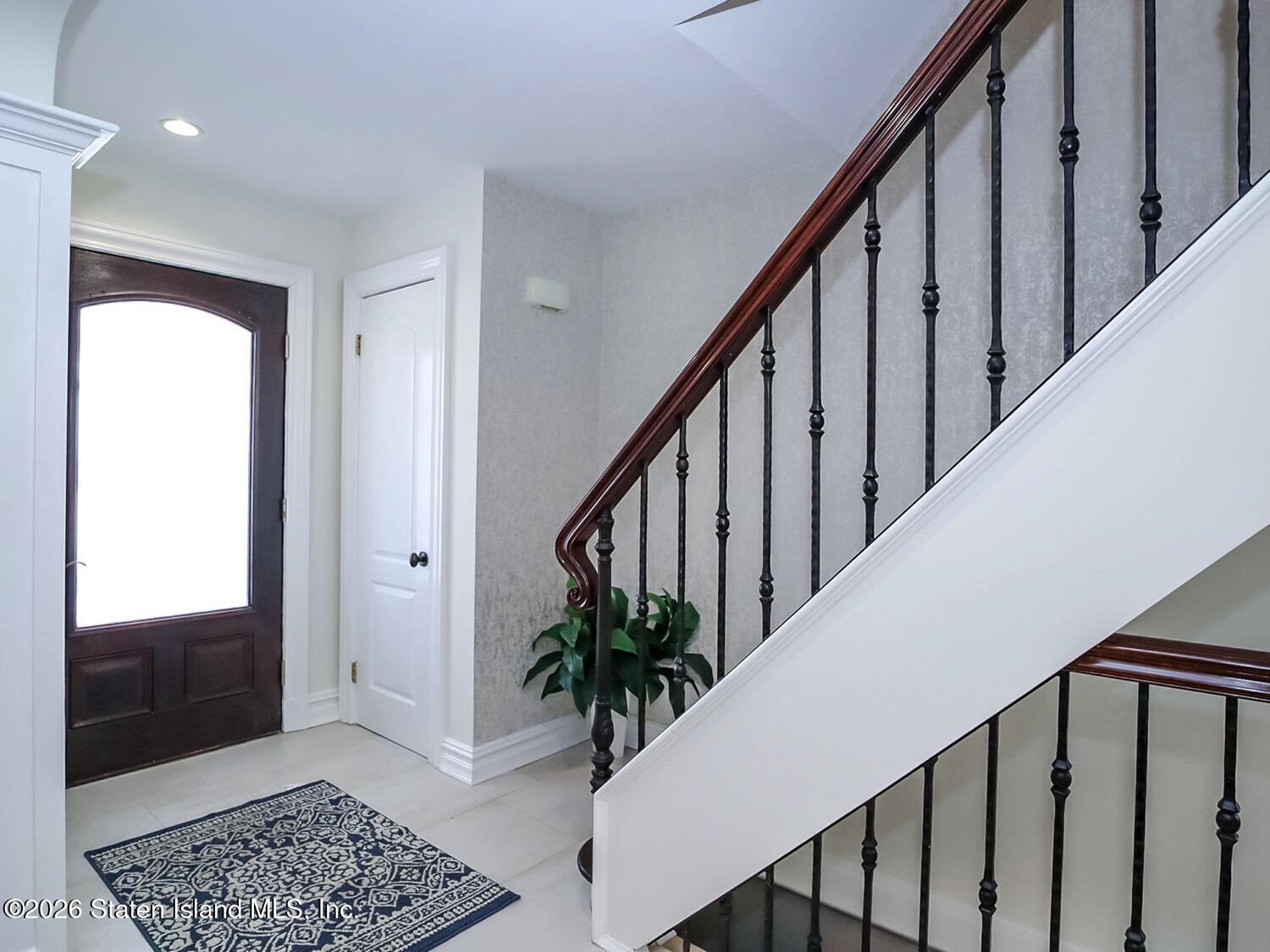 160 Wolverine Street Staten Island, NY 10306 - Photo 5 of 51 a view of entryway with wooden floor and stairs