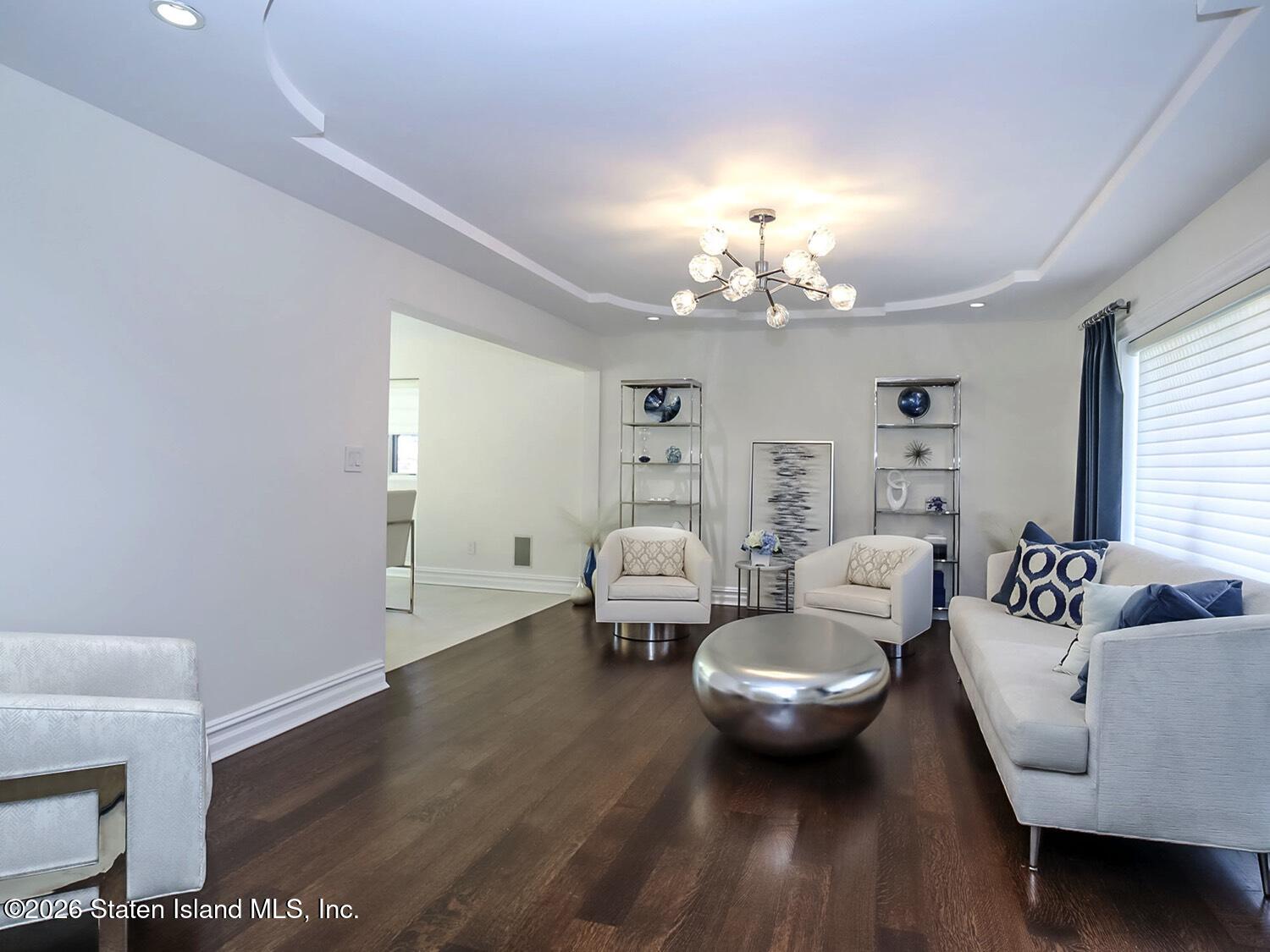 160 Wolverine Street Staten Island, NY 10306 - Photo 7 of 51 a living room with furniture and a chandelier
