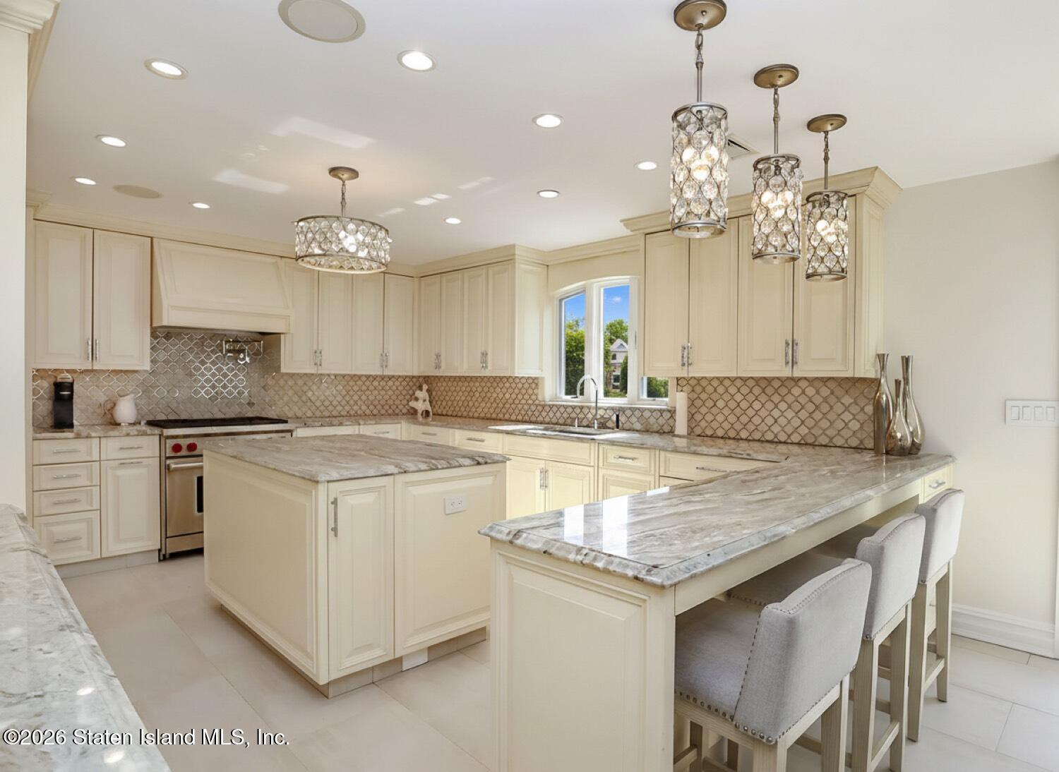 160 Wolverine Street Staten Island, NY 10306 - Photo 9 of 51 a kitchen with kitchen island granite countertop a sink and white cabinets